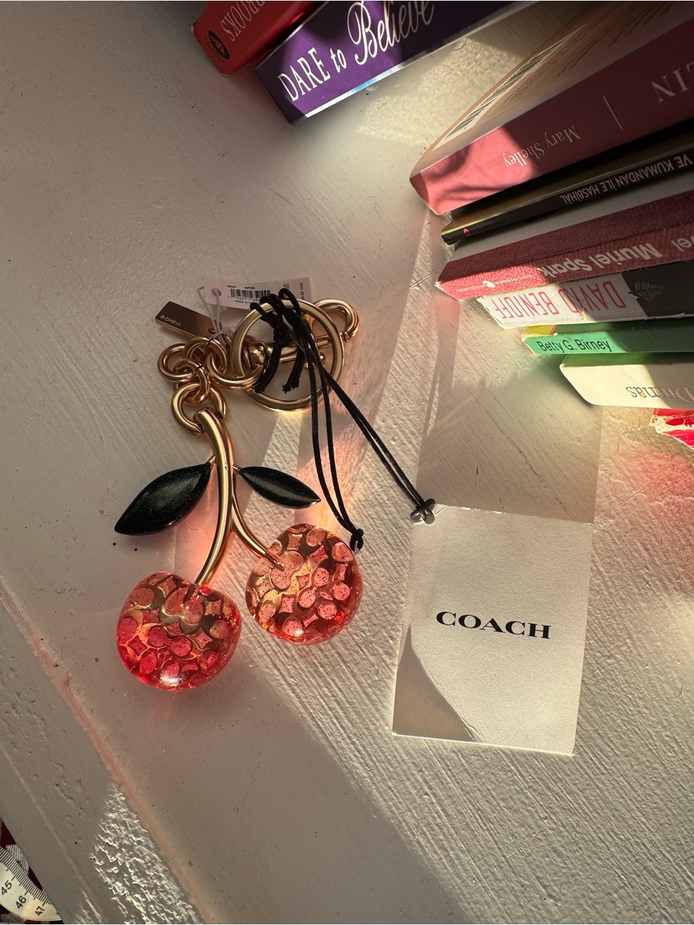 Coach Gold-Tone Pink Cherry Charm Bracelet Accent